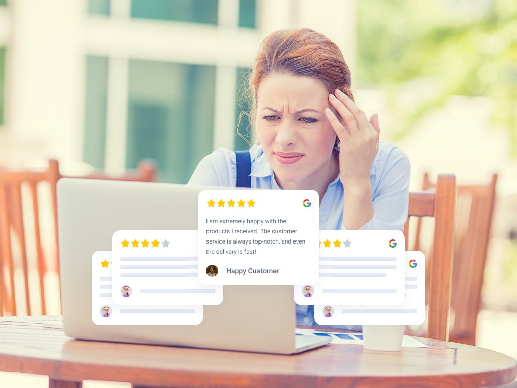 stressed woman on a laptop, reviews floating in the picture