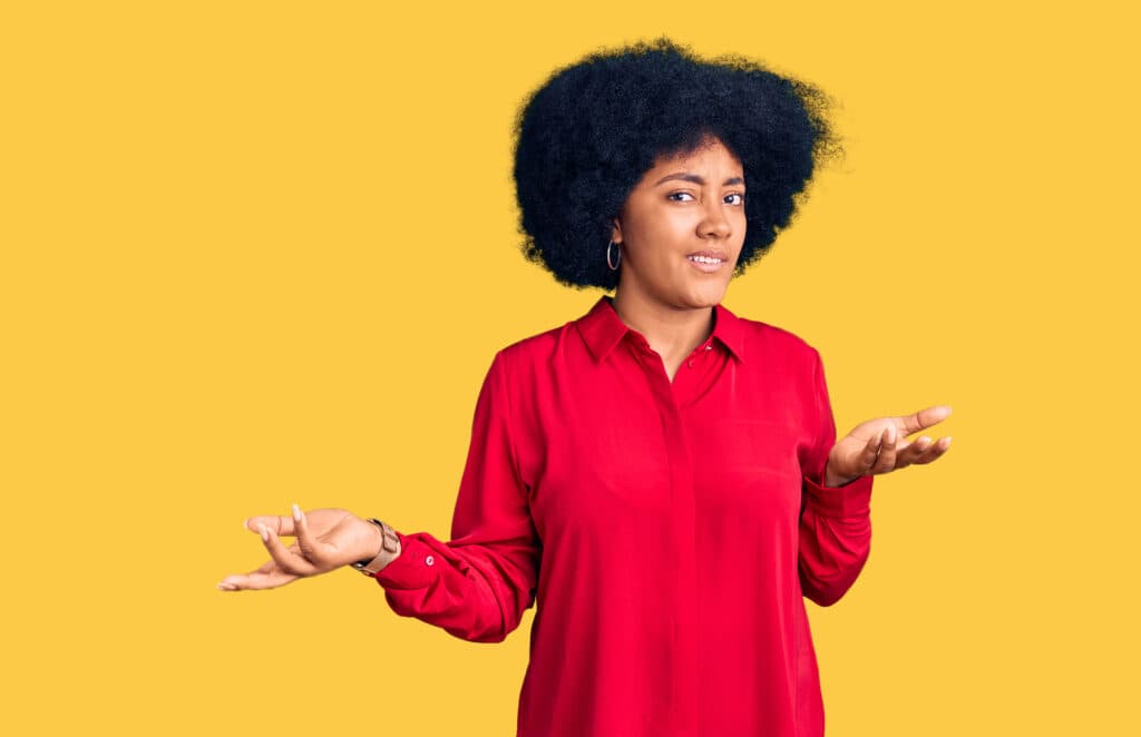 Young african american girl wearing casual clothes clueless and confused with open arms, no idea concept.